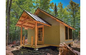 Snowshoe Lodge, two miles south along the Seboeis Riverside Trail, is your turnaround point.